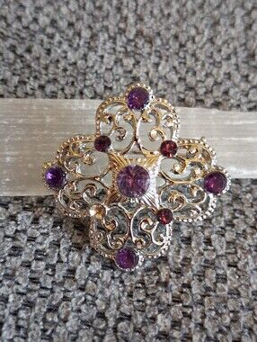 Gold-Tone Filigree Brooch with Purple Gem Accents